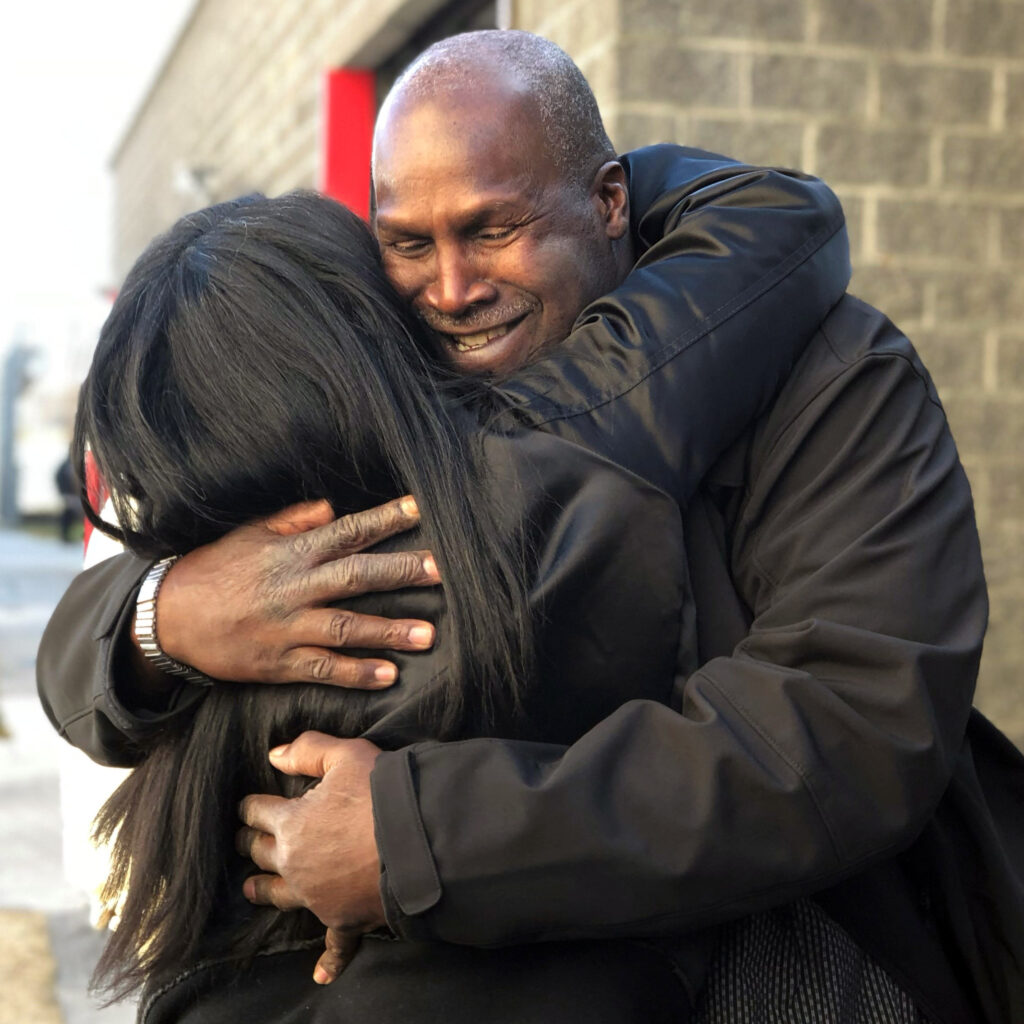 Malcolm Alexander hugging